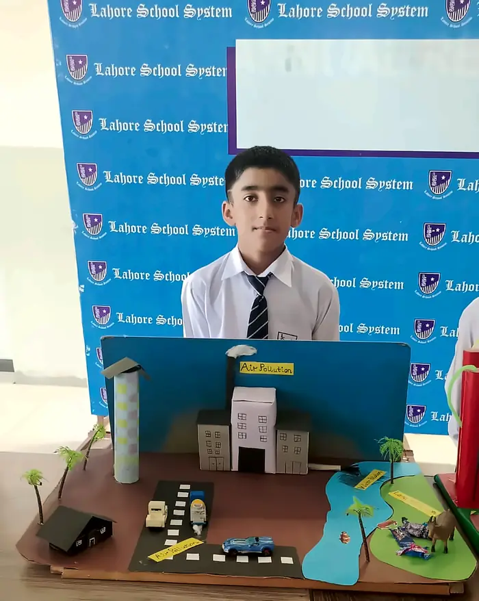 A student presenting his model at the science exhibition