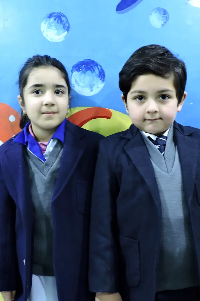 Two Pre-School children in school blazers